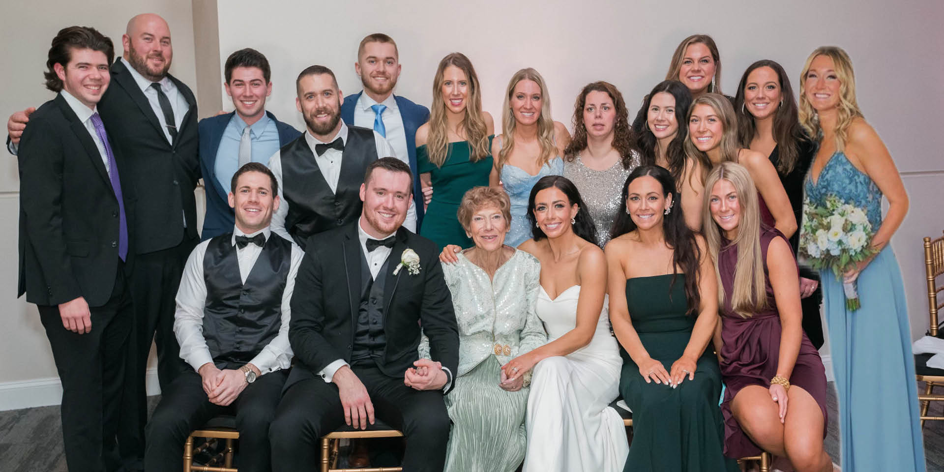 Wedding party sitting and standing around Norma McPeak | Doylestown Health