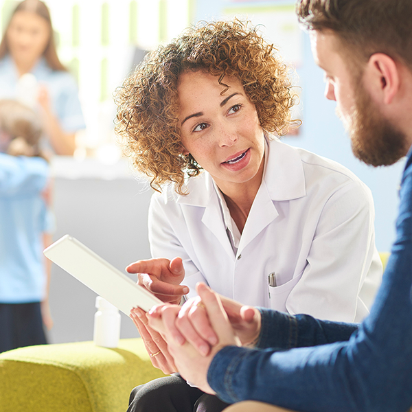 Patients discussing an hospital form | Doylestown Health